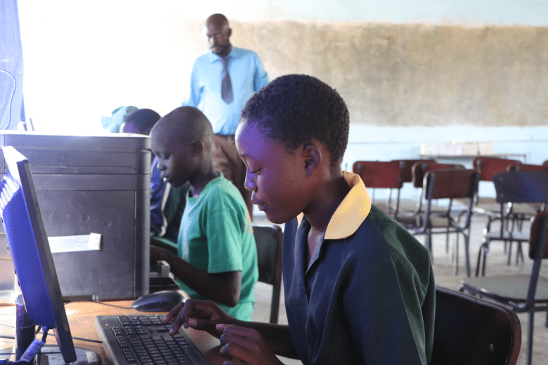 Antonette (12) operating a computer
