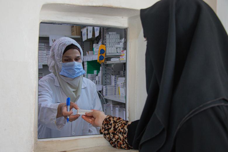 Amira receiving her medications.