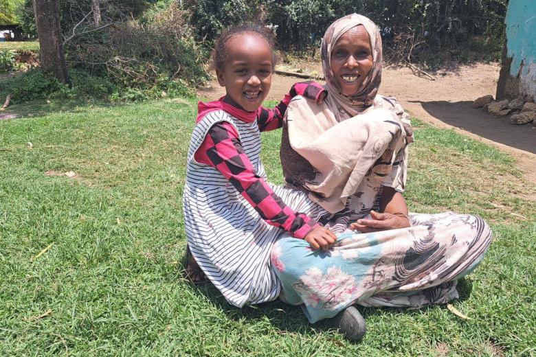 Nani smiling with her mother