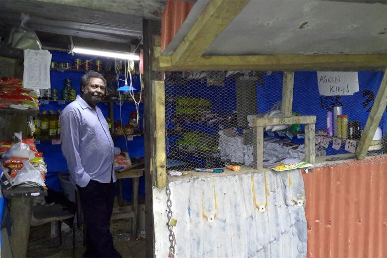 Charlie standing in his shop