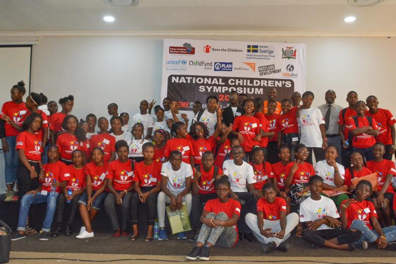 Children pose for a picture at the children symposium