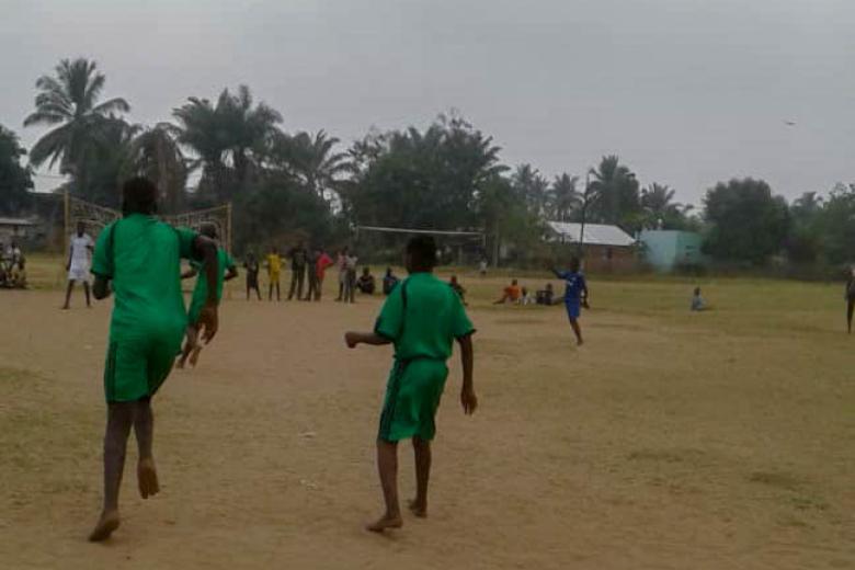 Albert* plays football with other children at World Vision's Child Friendly Space