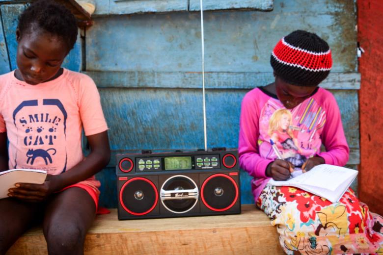 Listening to the teaching on the radio in Sierra Leone