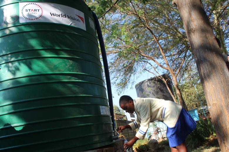 school children accessing clean water in schools