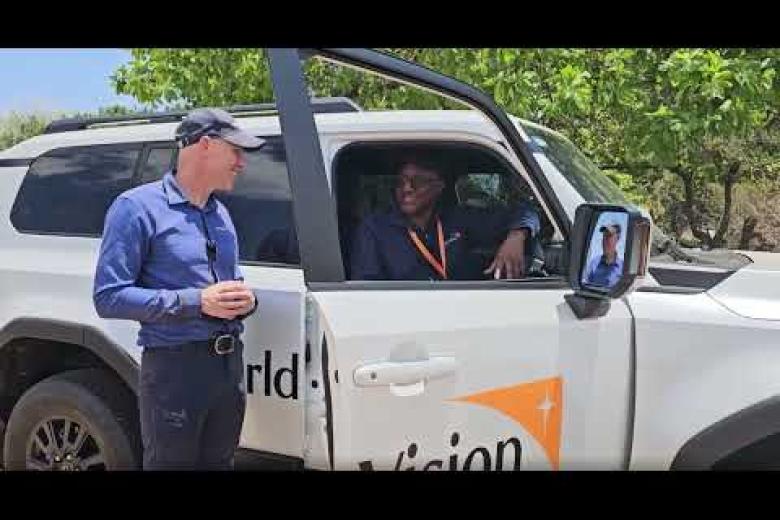 World Vision International President Andrew Morley chats with World Vision Zambia's Driver Maxwell.