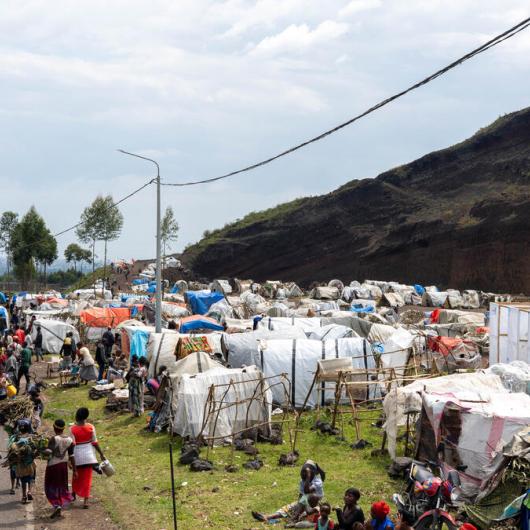 Families are camped in an informal settlement in eastern DRC, displaced by violence