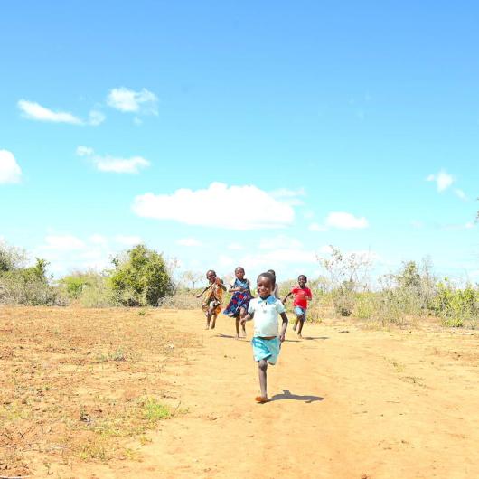 Eight-year-old Nadzuwa, playing with her siblings and friends.