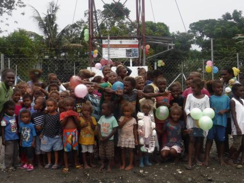 Sun Valley children infront of their new water supply system.