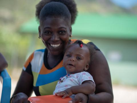 Mother and infant at Go Baby Go training in Haiti
