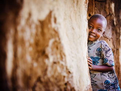 Child smiling in traditional clothing