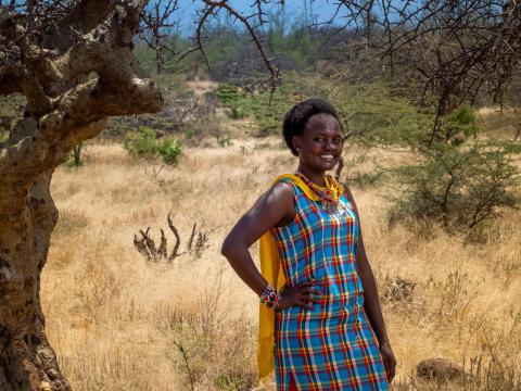 Nancy, a formally sponsored child, stands at her home in Kenya