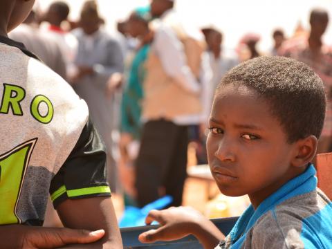 Child at the food distribution in Konio.JPG