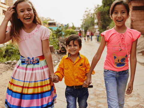 Children walking and holding hands