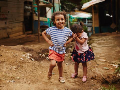 A girl and her sister play in rural Colombia