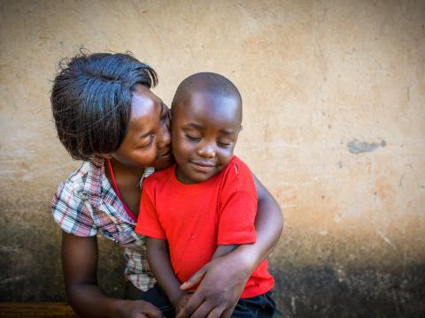 A mother holds her child