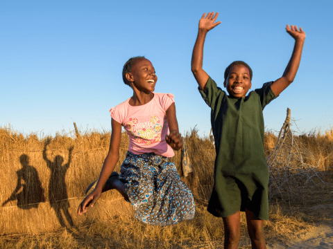 Two girls jumping