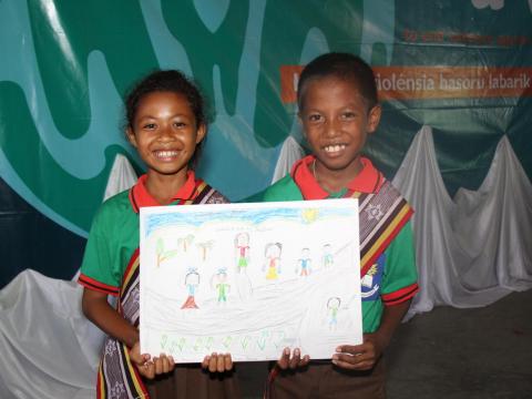 Children holding sign against violence