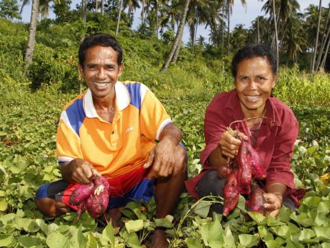Two women planting seeds of hope