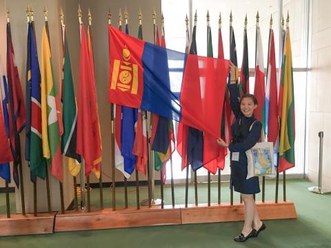 Mongolian girl at UN with her flag