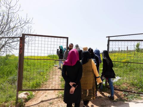 Young Syrian girls enrolled in the agriculture classes go to the field for their agriculture training.