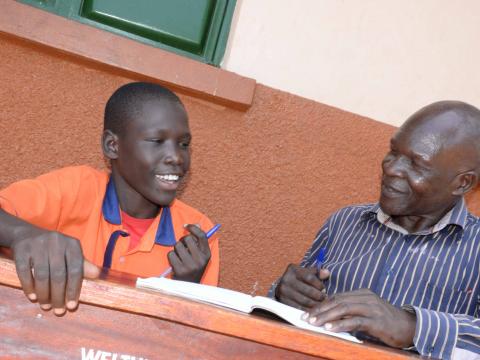 Solomon with his English teacher, he says he now lives life to its fullness