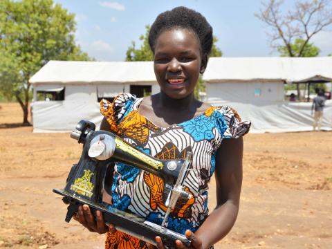 Mercy Leyo, 16, after receiving her startup kit from World Vision