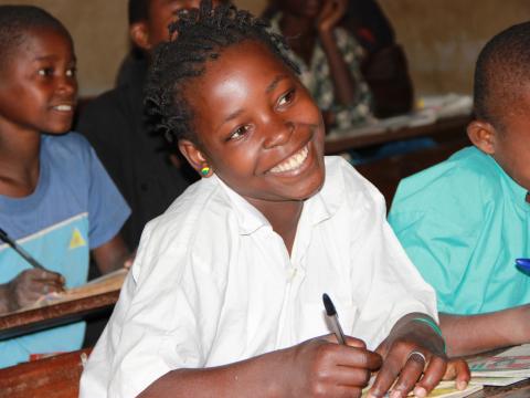 child smiling in school