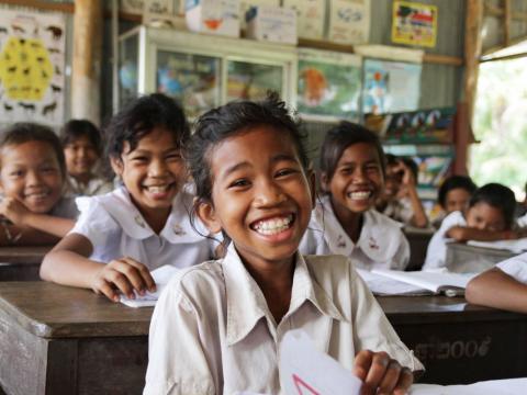 Khmer female student smiles along with classmates in rural province Cambodia