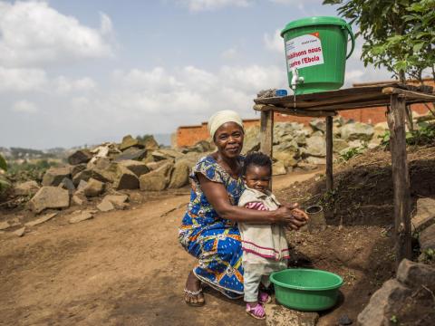 Child orphaned by Ebola washes her hands