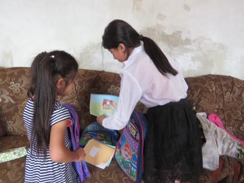 Girls having received school bags from Carrefour