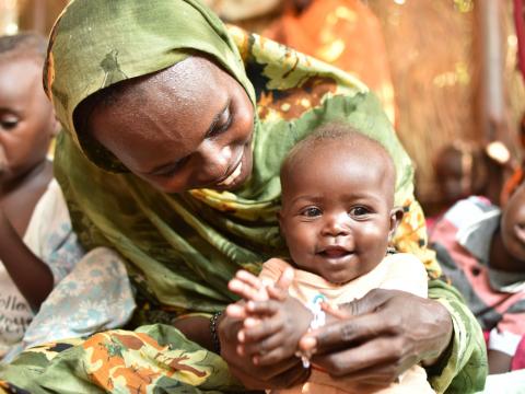 Mashier enjoys plays time with her child, pictured here at the GBG make shift centre. 