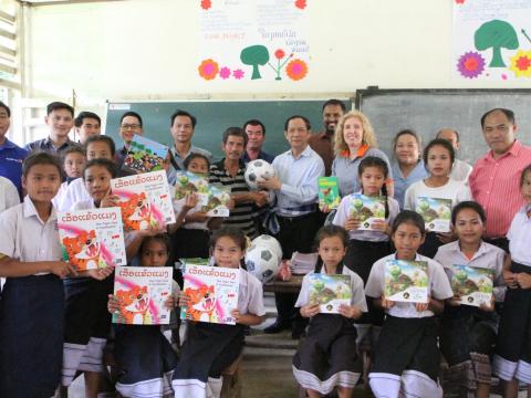 Handing over story books and Sport equipments to the school Principal