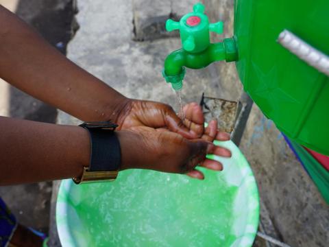 An individual washes their hands