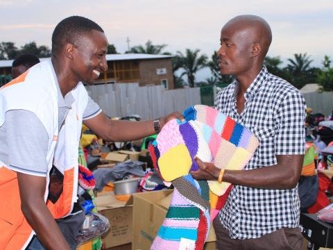 HEA manager distributing charities to those affected by floods in Bujumbura 