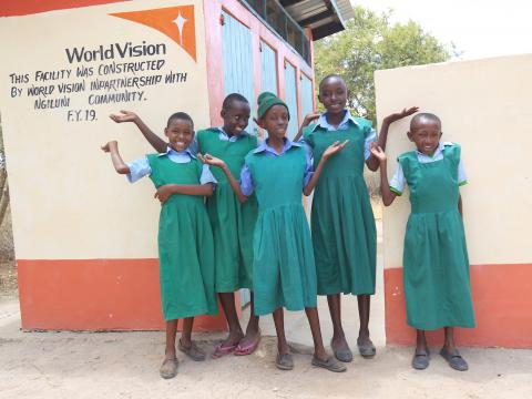 Pupils of Ngunini Primary School in Kenya's Makueni County outside the new toilet block constructed with support from World Vision. ©World Vision Photo/Hellen Owuor