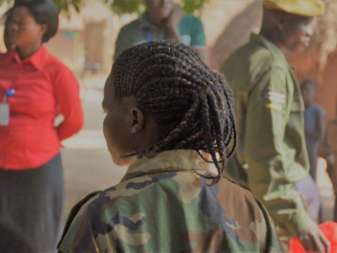 girl child soldier in camo gear