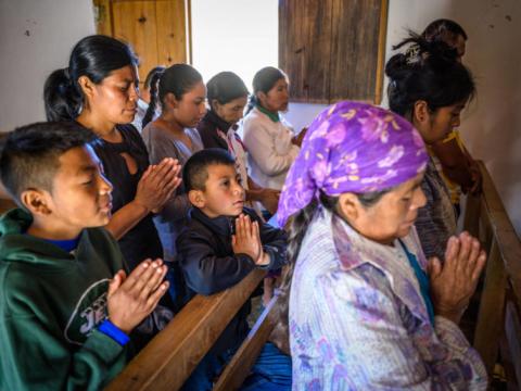 Women and children praying