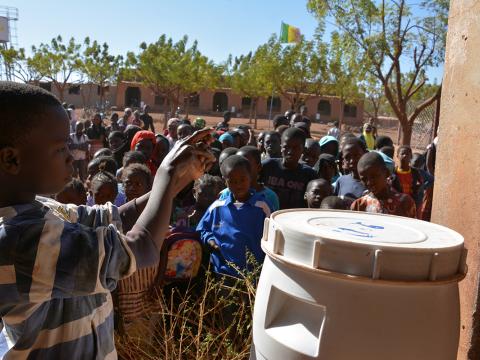 A pupil at Falayan Primary School in Mali, demonstrates hand-washing techniques to follow students. World Vision has promoted better hygiene standards.