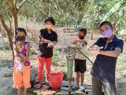 Children teaching other hand-washing