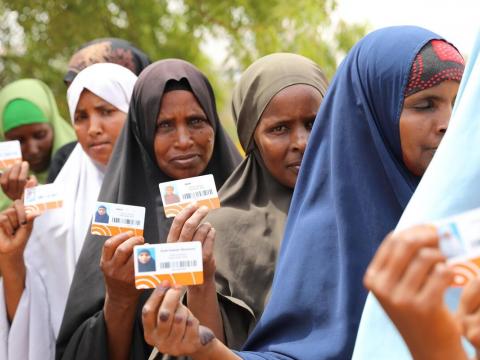 IDPs and drought-affected beneficiaries lining up to receive a cash distribution from World Vision and its CCD partners in Somali region, Ethiopia, as part of our humanitarian disaster management team's cash and voucher assistance programming promoting dignity for people affected by emergencies, providing them with choice, dignity, and flexibility while helping build resilience, by driving the recovery of local markets.
