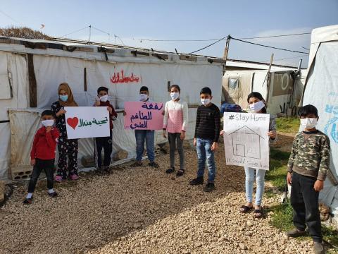 Children holding signboards