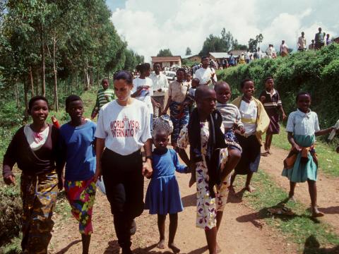 World vision Staff and Hidden Hero walks with displaced children