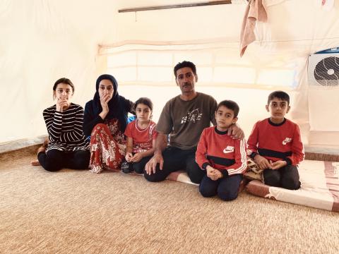 Dakheel and his family in their tent at Bardarash Camp