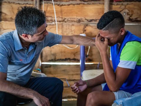 Venezuela refugee with world vision staff in Colombia