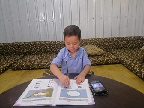 Five-year-old Qutaibah, a participant in our ECD programme at Azraq Refugee Camp is studying remotely due to COVID-19 lockdown