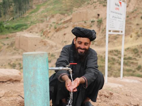 Ezatullah is happy for having water tap in his community.