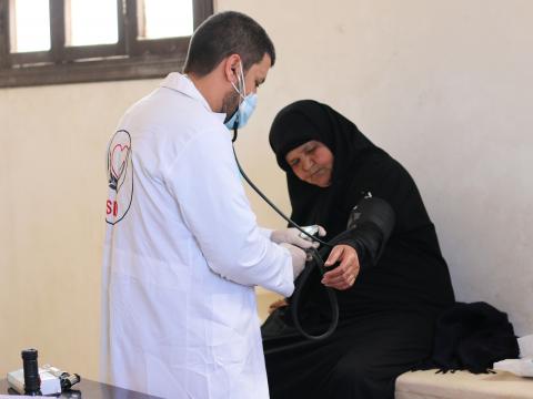 Balsam getting checked by the medical mobile unit's doctor in North-West Syria