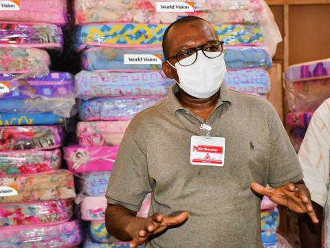 Dr. Mohamed Juldeh Jalloh, Vice President of the Republic of Sierra Leone receiving World Vision's donations to quarantine facilities