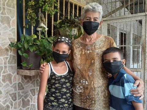 Boy with grandmother and sister.