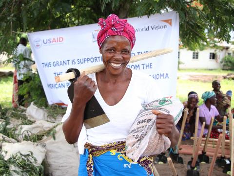 woman carrying seeds 2